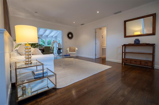 living room with dark hardwood / wood-style flooring and ornamental molding