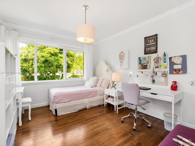 bedroom featuring ornamental molding and dark hardwood / wood-style floors