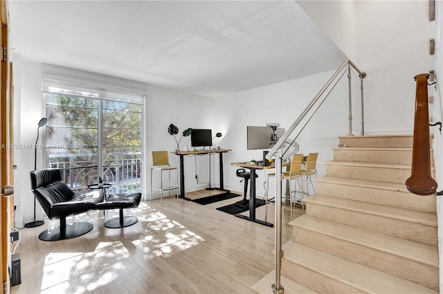 sitting room with hardwood / wood-style flooring