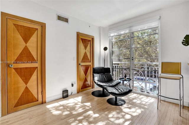 sitting room with light hardwood / wood-style floors