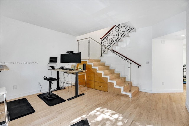 exercise area featuring light wood-type flooring