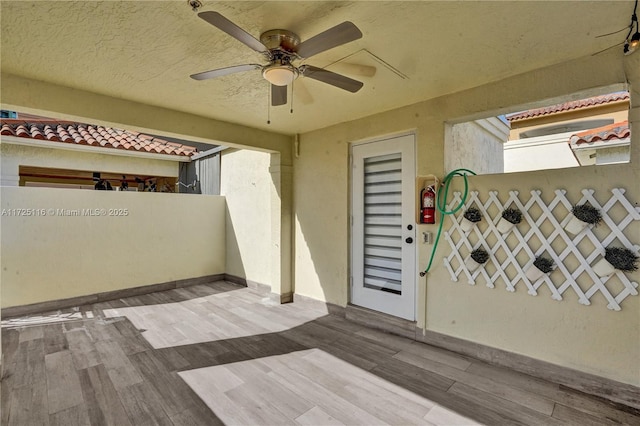 view of patio featuring ceiling fan