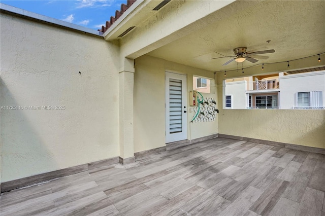 view of patio / terrace featuring ceiling fan