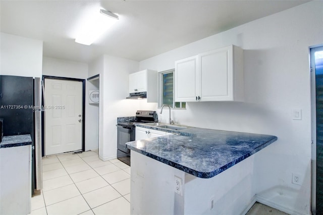 kitchen featuring kitchen peninsula, black range with electric stovetop, sink, light tile patterned floors, and white cabinets