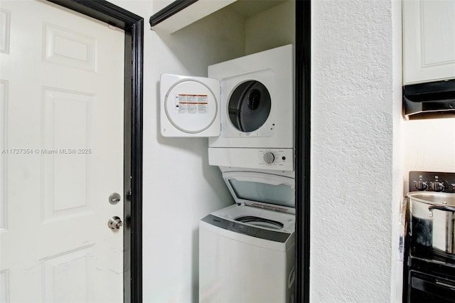 laundry area with stacked washer and clothes dryer