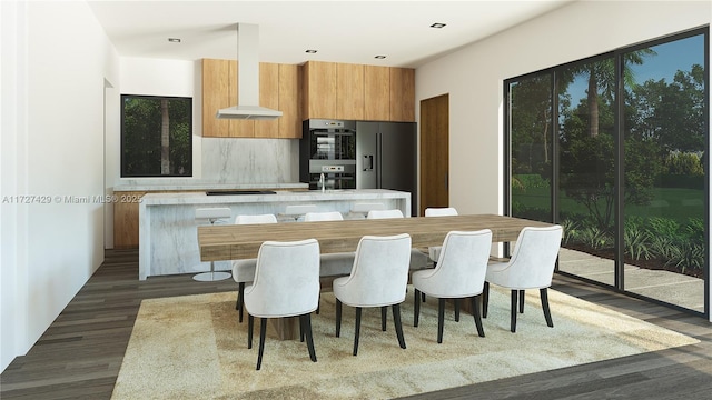 kitchen featuring dark wood-type flooring, wall chimney exhaust hood, backsplash, and black appliances