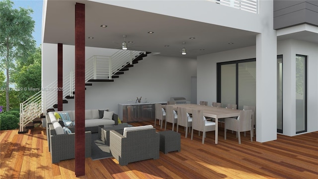 living room with plenty of natural light and hardwood / wood-style floors