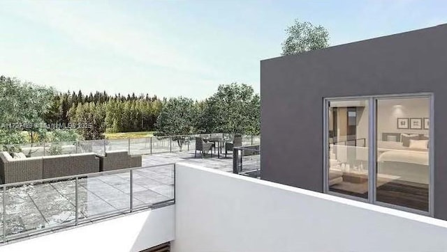 balcony with an outdoor living space and a patio area