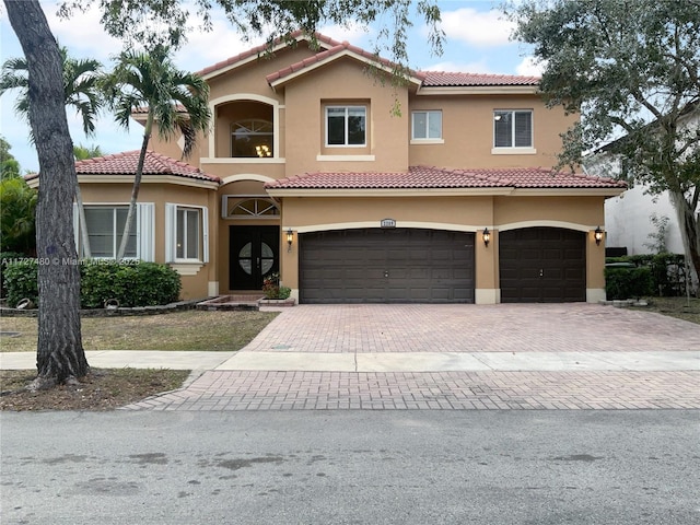 mediterranean / spanish-style home featuring a garage