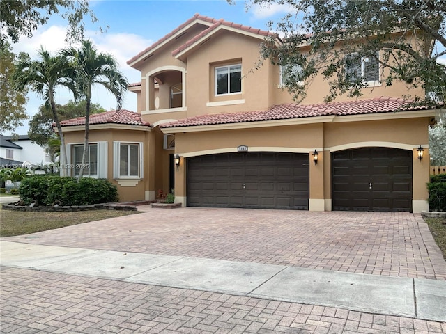 mediterranean / spanish house featuring a garage