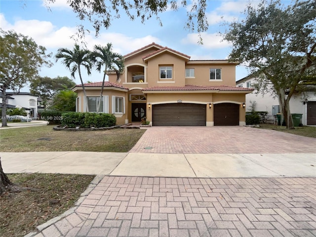 mediterranean / spanish-style house featuring a garage