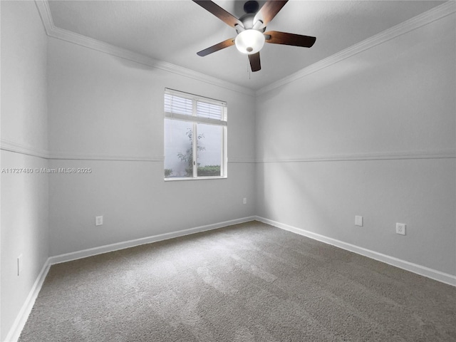 carpeted empty room featuring ceiling fan and crown molding