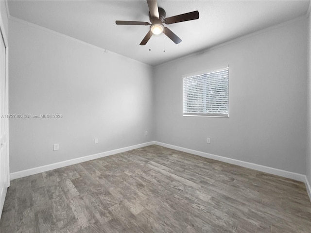 spare room featuring ceiling fan, crown molding, and hardwood / wood-style floors