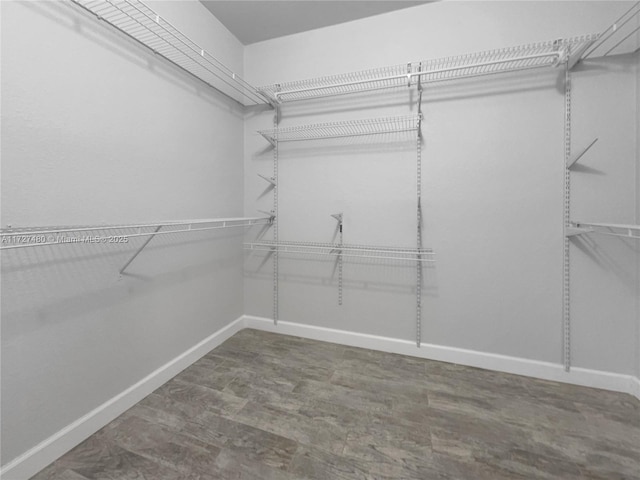 walk in closet featuring hardwood / wood-style floors