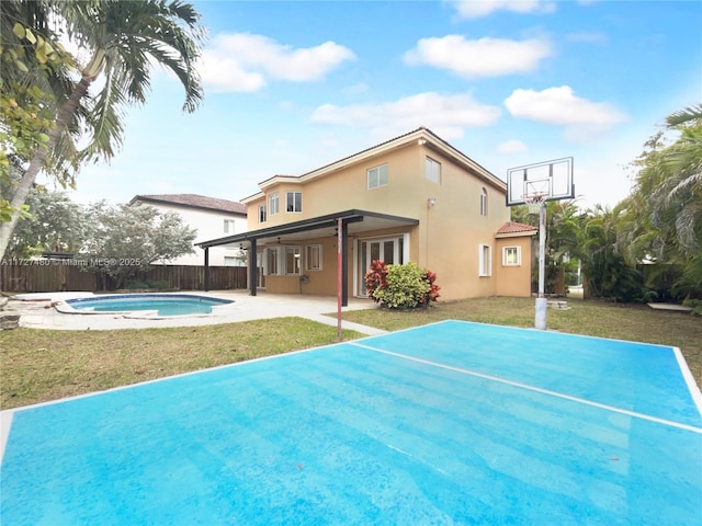 exterior space featuring a fenced in pool and a yard