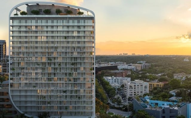 view of outdoor building at dusk