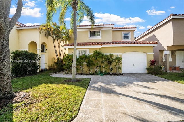 mediterranean / spanish-style house featuring a front lawn and a garage