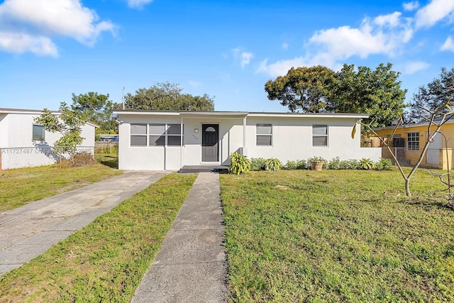 ranch-style home with a front yard