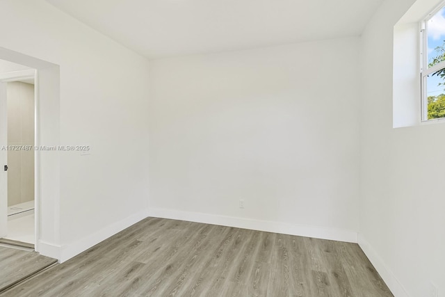 spare room with light hardwood / wood-style floors