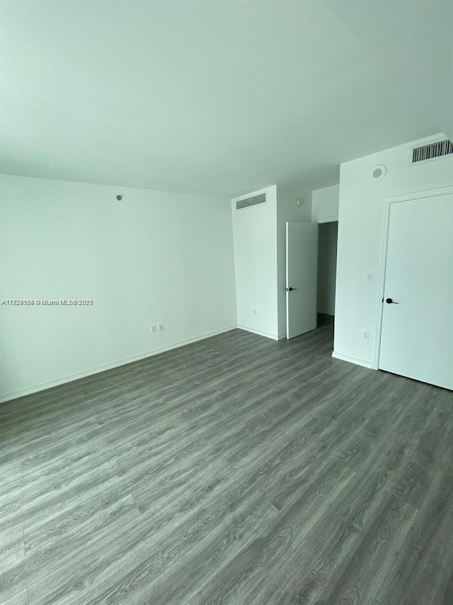 unfurnished room with visible vents and light wood-style floors