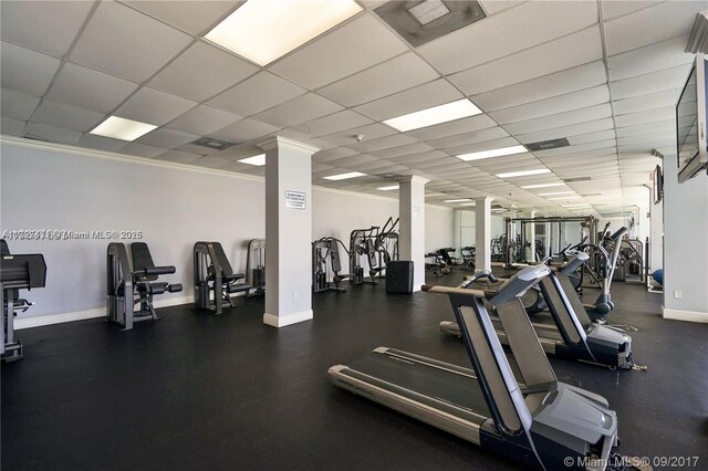 exercise room featuring ornamental molding