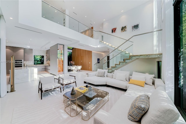 living room featuring a towering ceiling