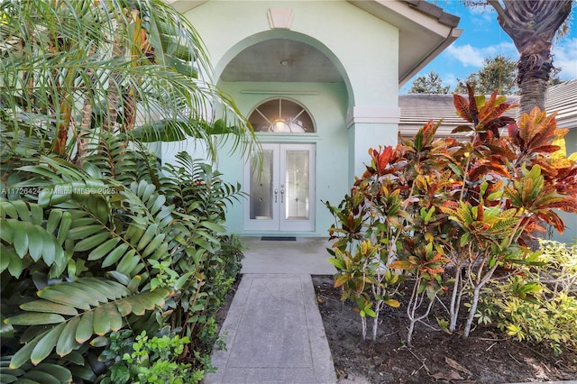 view of exterior entry featuring french doors