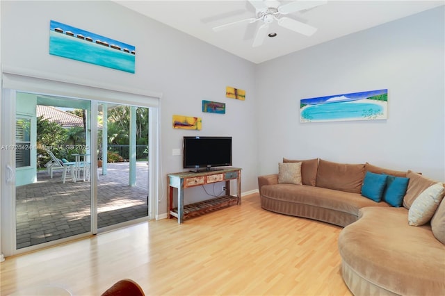 living room with ceiling fan and hardwood / wood-style floors