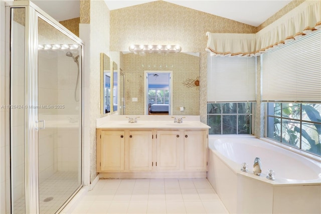 bathroom with vanity, lofted ceiling, and plus walk in shower