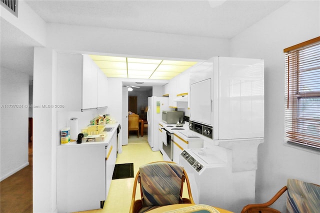 kitchen with ceiling fan, white cabinets, and white electric range oven