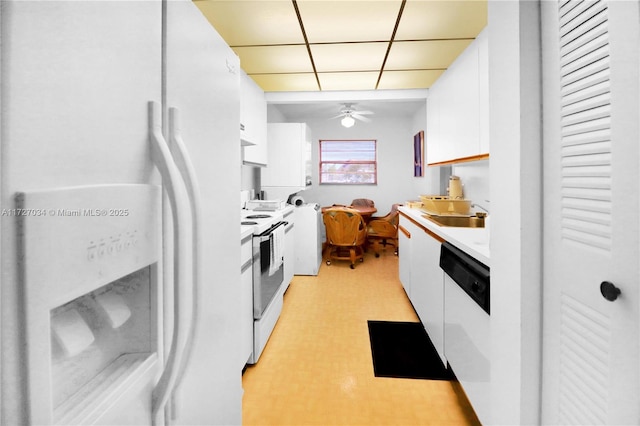 kitchen with white cabinetry, sink, white appliances, and ceiling fan