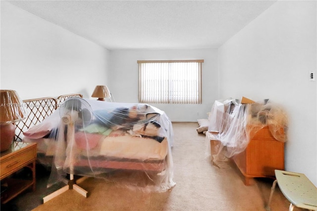 bedroom featuring light carpet