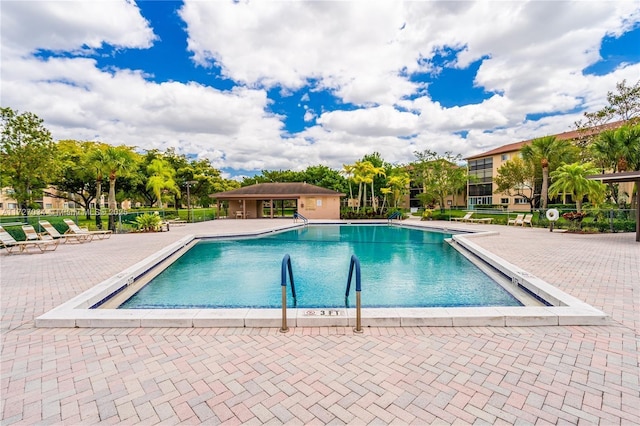 view of swimming pool featuring a patio area