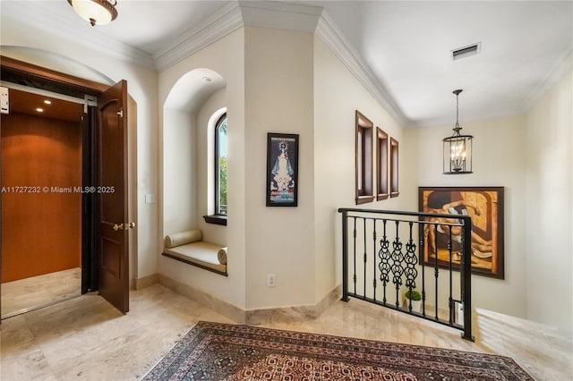 corridor with crown molding, an upstairs landing, visible vents, and a chandelier