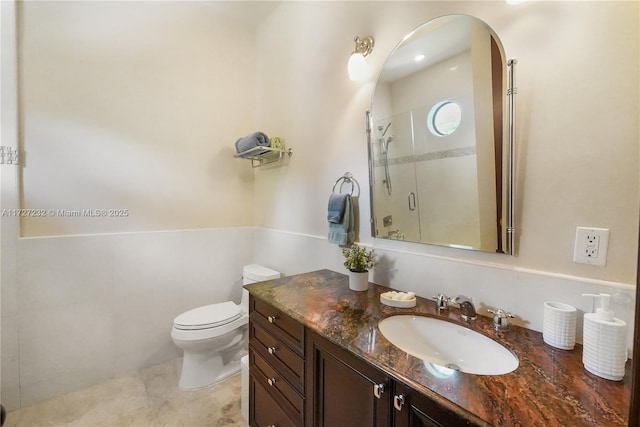 bathroom with toilet, a stall shower, tile patterned floors, and vanity