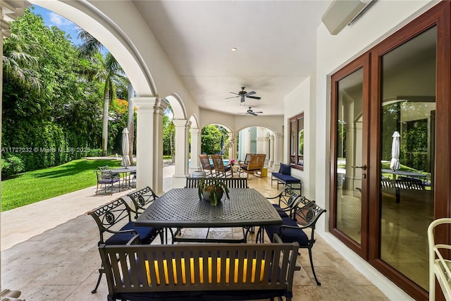 view of patio featuring ceiling fan and outdoor dining space