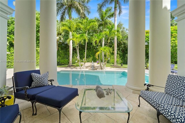 view of patio featuring ceiling fan and an outdoor living space