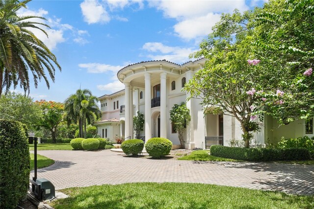 rear view of property featuring a yard