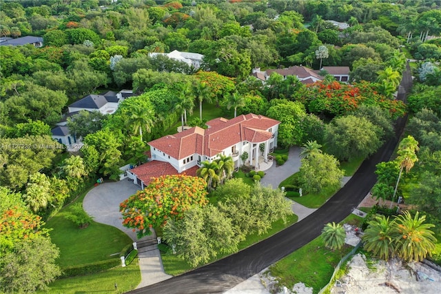 aerial view featuring a wooded view
