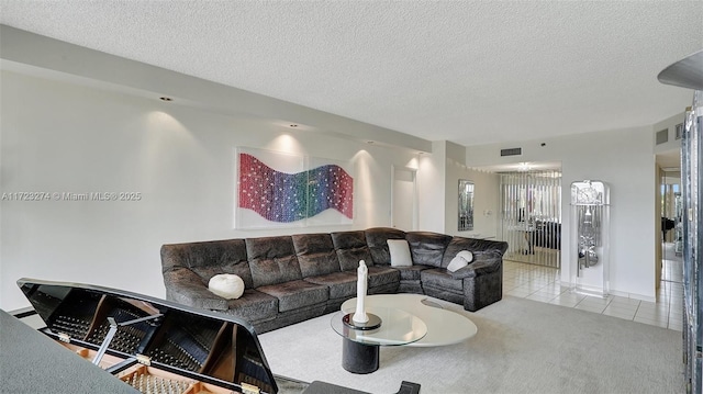 tiled living room with visible vents, a textured ceiling, and carpet flooring