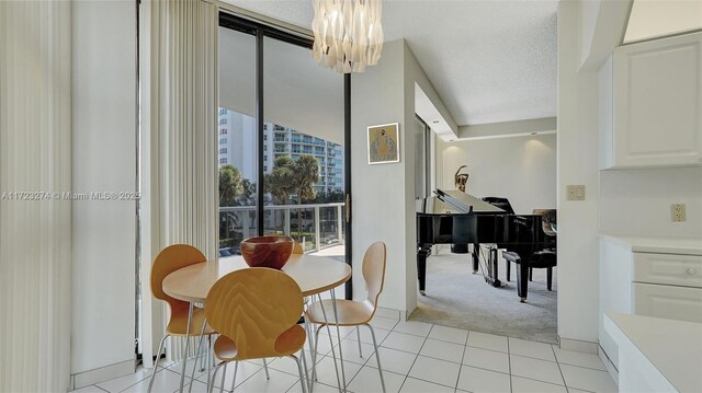 bedroom featuring expansive windows, access to exterior, carpet, and a textured ceiling