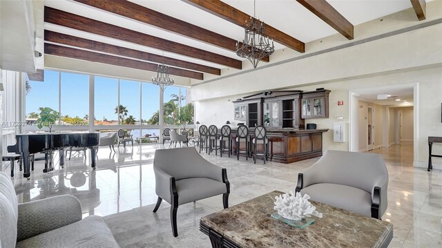 living area featuring marble finish floor, beamed ceiling, and an inviting chandelier