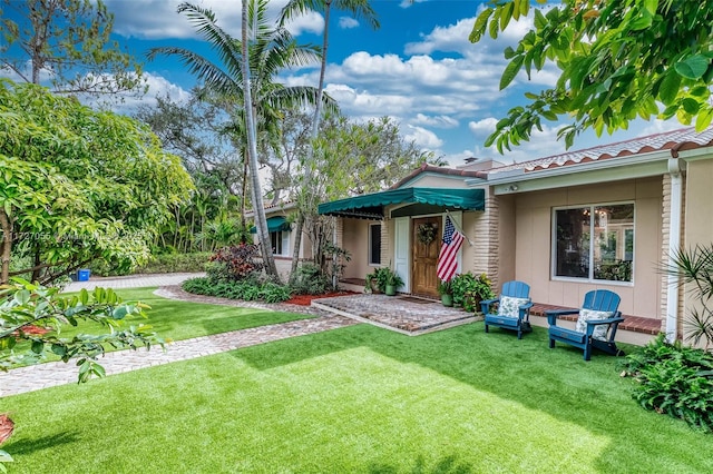 view of front of home with a front yard