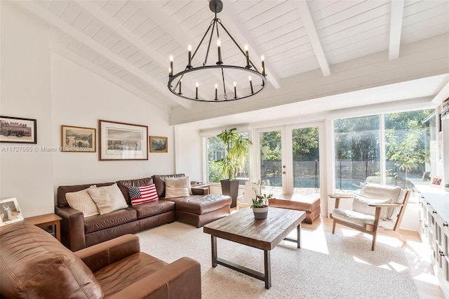 living room with wood ceiling, beam ceiling, high vaulted ceiling, french doors, and a chandelier