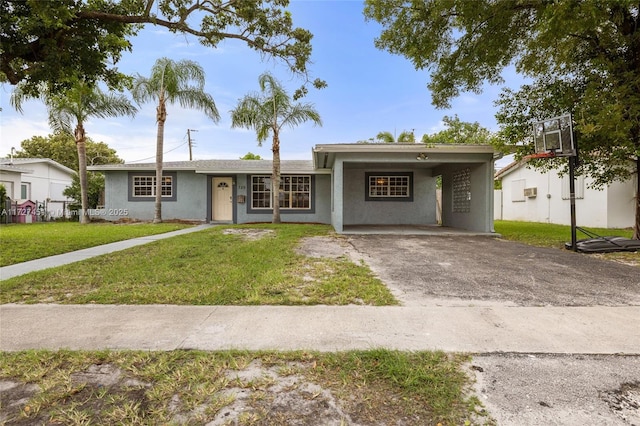 single story home with a front lawn and a carport