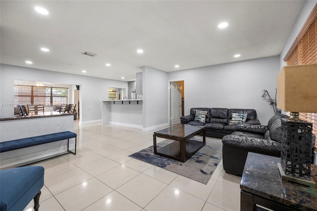 living room with light tile patterned floors