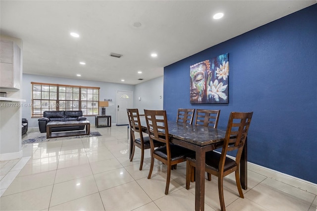 dining space with light tile patterned flooring