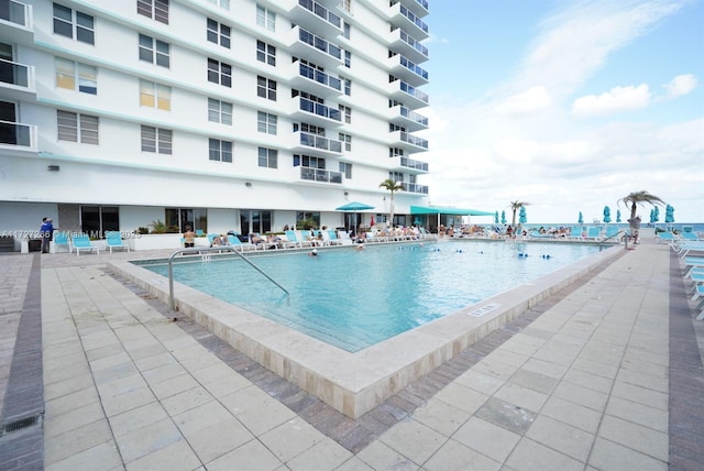 view of swimming pool featuring a patio area