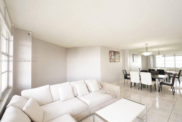 tiled living room featuring a healthy amount of sunlight