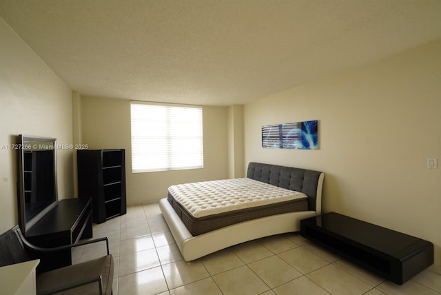 bedroom featuring light tile patterned flooring